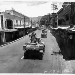 US Army M3 Stuart light tanks in maneuvers, Beretania Street in the Honolulu business district, Hawaii, 30 August 1942.