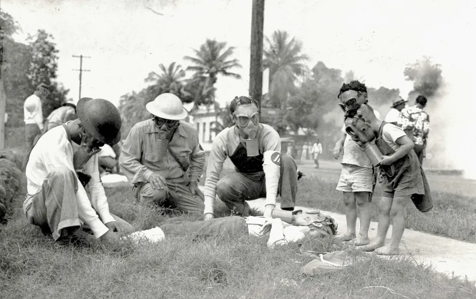 Volunteers conduct a poison-gas drill in Honolulu. Everyone over age 7 in Hawaii was issued a gas mask after the Dec. 7, 1941 attack. Courtesy: Desoto Brown Collection